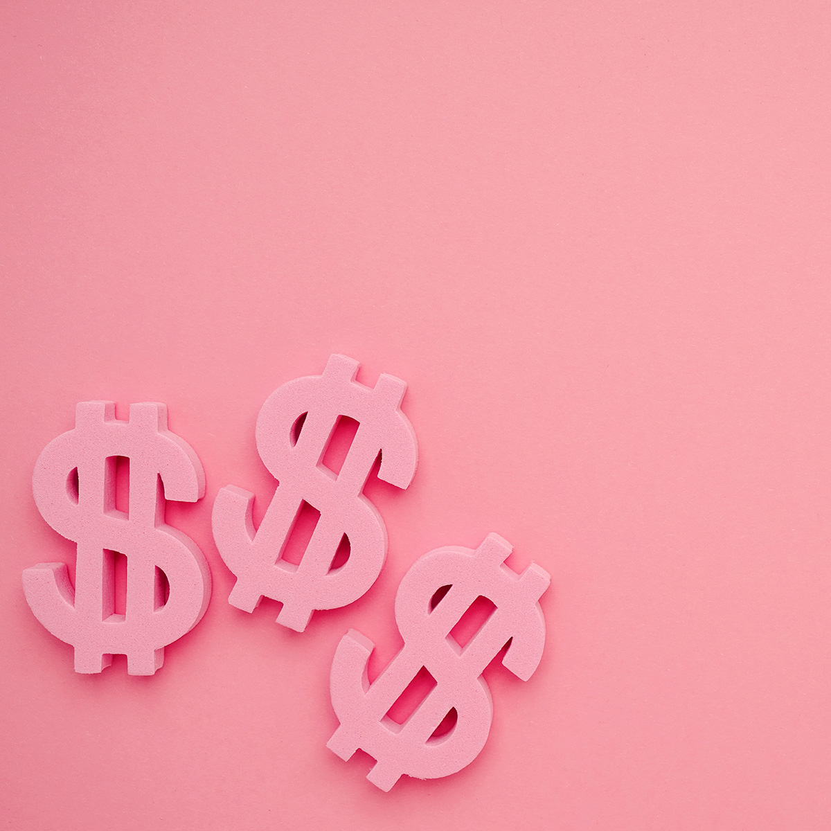 Pink background with three dollar signs on bottom left corner