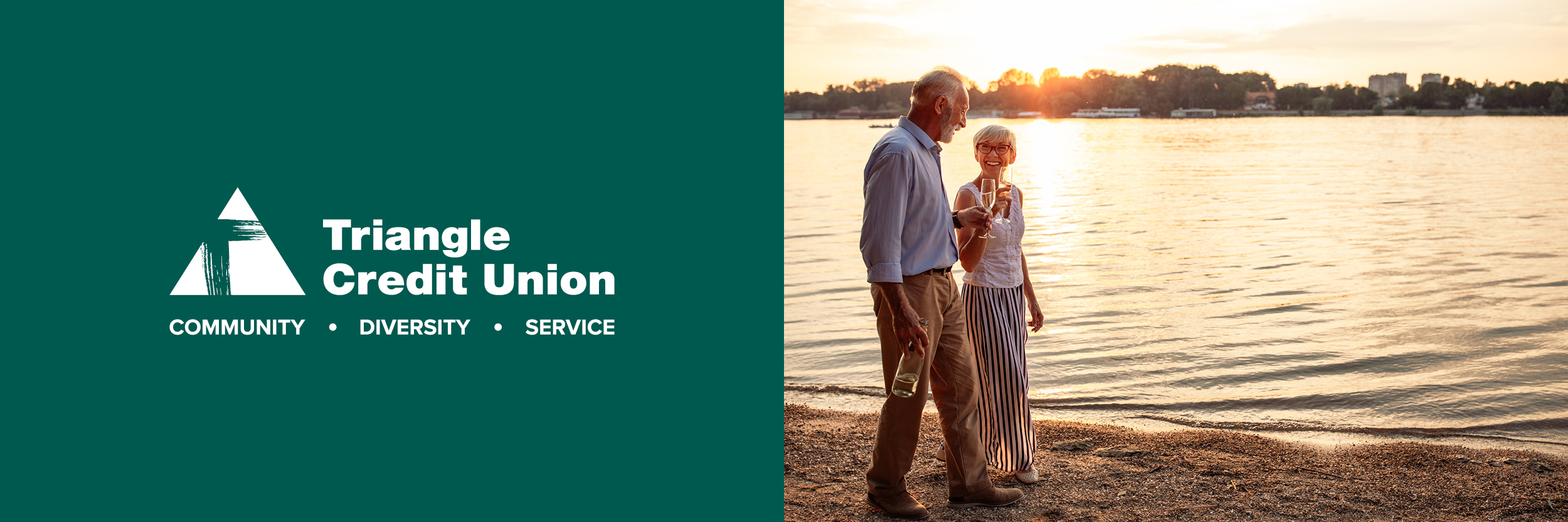 elderly couple walking on lake shore during sunset